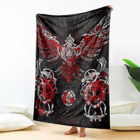 Viking rune blanket draped with bold red winged design and circular animal motifs