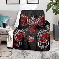 Viking rune blanket shown on a couch with black, red, and white emblem pattern