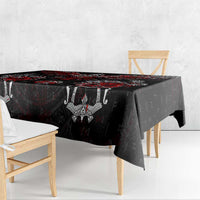 Black tablecloth with red and white Viking rune and raven motif, draped over table