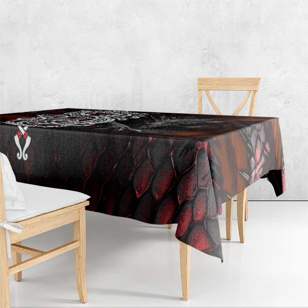 Norse dragon tablecloth draped over table, dark red and black scale design