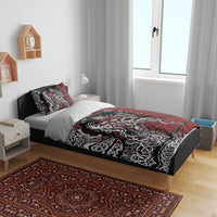 Viking warrior bedding set on bed, red and black duvet cover with ornate knot graphics