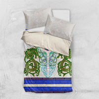 Folded bedding set with white pillow shams and duvet in green dragon knot and blue band