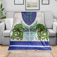 Celtic knot dragon throw blanket with green and blue motifs on light cream base