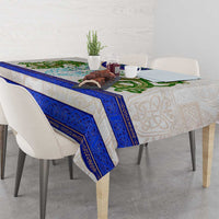 Dragon Celtic knot tablecloth with blue patterned edge over dining table