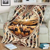 Buffalo bison tribal print throw blanket draped over couch with decorative border pattern