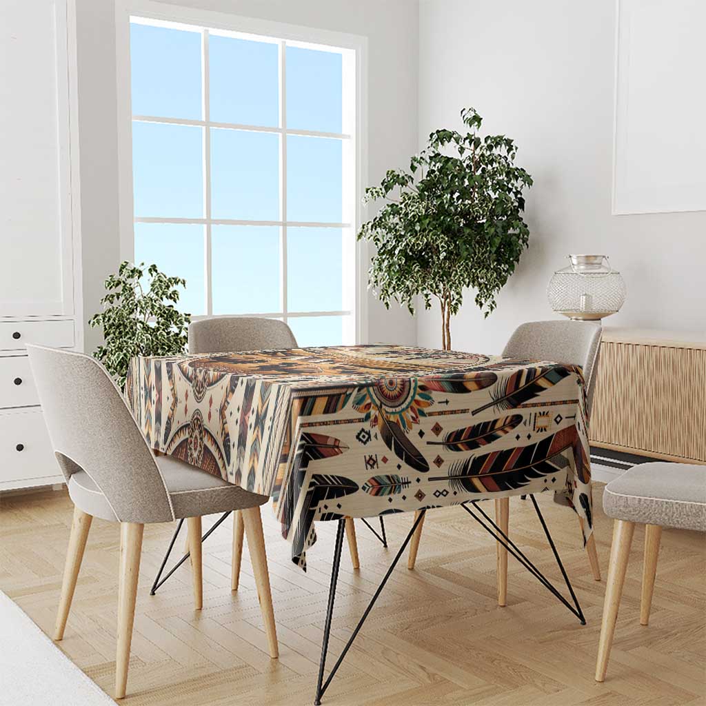 Bold patterned tablecloth with buffalo motif, tribal shapes, and multicolor feather accents