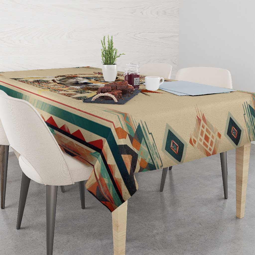 Beige rectangular wolf artwork tablecloth with teal, red, and tan geometric trim