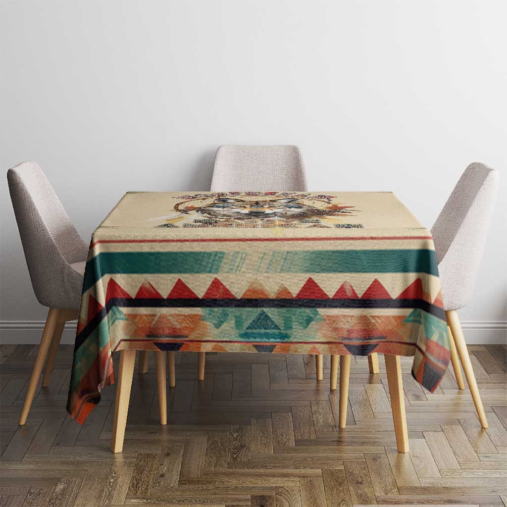 Beige wolf dreamcatcher tablecloth with multicolor border on wooden dining table