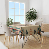 Beige wolf tablecloth with southwestern geometric band across dining table