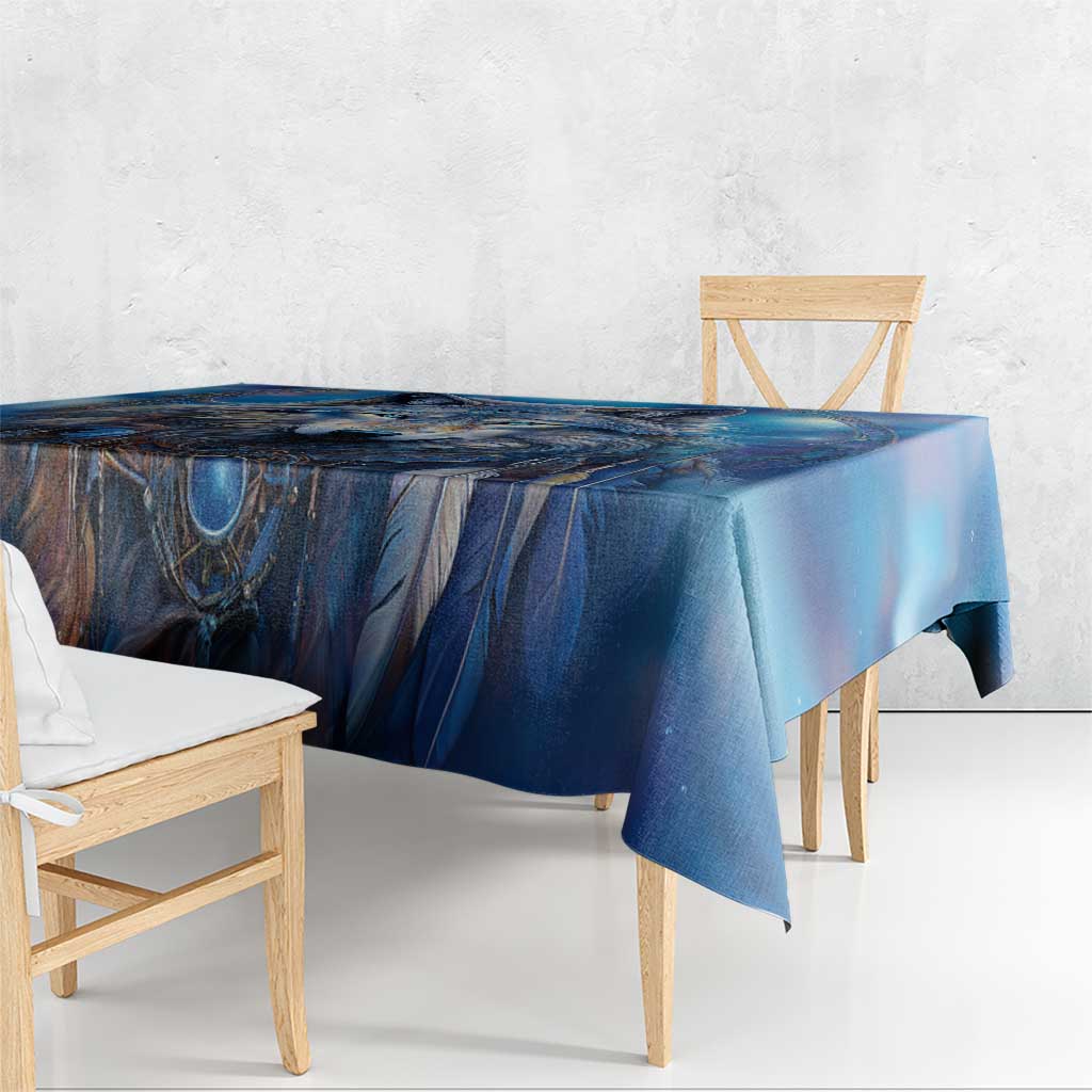 Blue wolf artwork tablecloth draped over a dining table with hanging corner