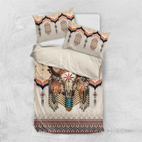Beige bedding set with two pillows and feathered skull duvet, navy diamond and orange zigzag trim