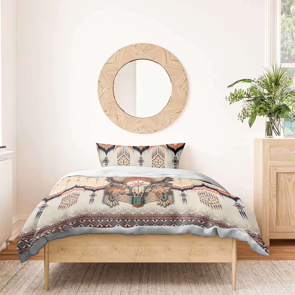 Beige duvet with feathered skull print and matching pillow, navy and orange tribal border