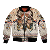 Beige bomber jacket with front zipper, black ribbed collar/cuffs, and tribal headdress graphic