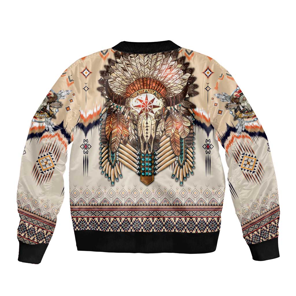 Beige bomber jacket with black ribbed trim and large central feathered headdress graphic