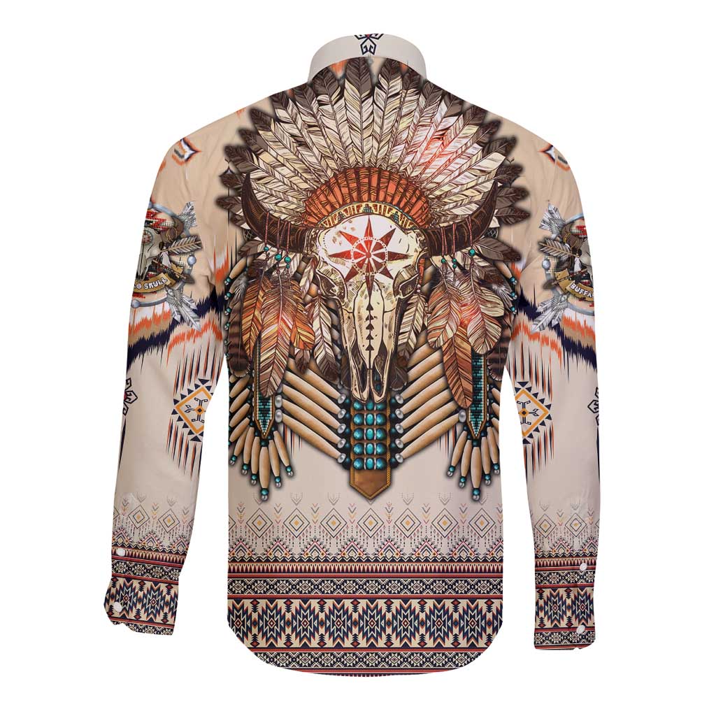 Beige long sleeve button shirt featuring central skull and feather headdress artwork