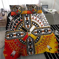 Tribal geometric duvet set in black, red, and yellow with central cross motif.