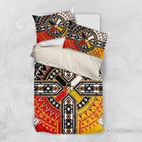 Geometric duvet set with matching pillow covers; black, red, yellow, and white patterns.