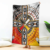 Native American style blanket with bold geometric starburst pattern in black, white, red, yellow