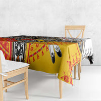 Geometric tablecloth with red and yellow center panels, black-and-white tribal accents
