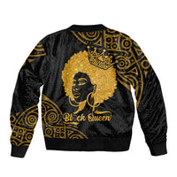 Black bomber jacket, back view, gold portrait with crown and swirl pattern; ribbed cuffs