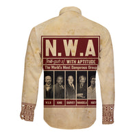 Tan long sleeve button shirt with N.W.A back graphic and patterned hem