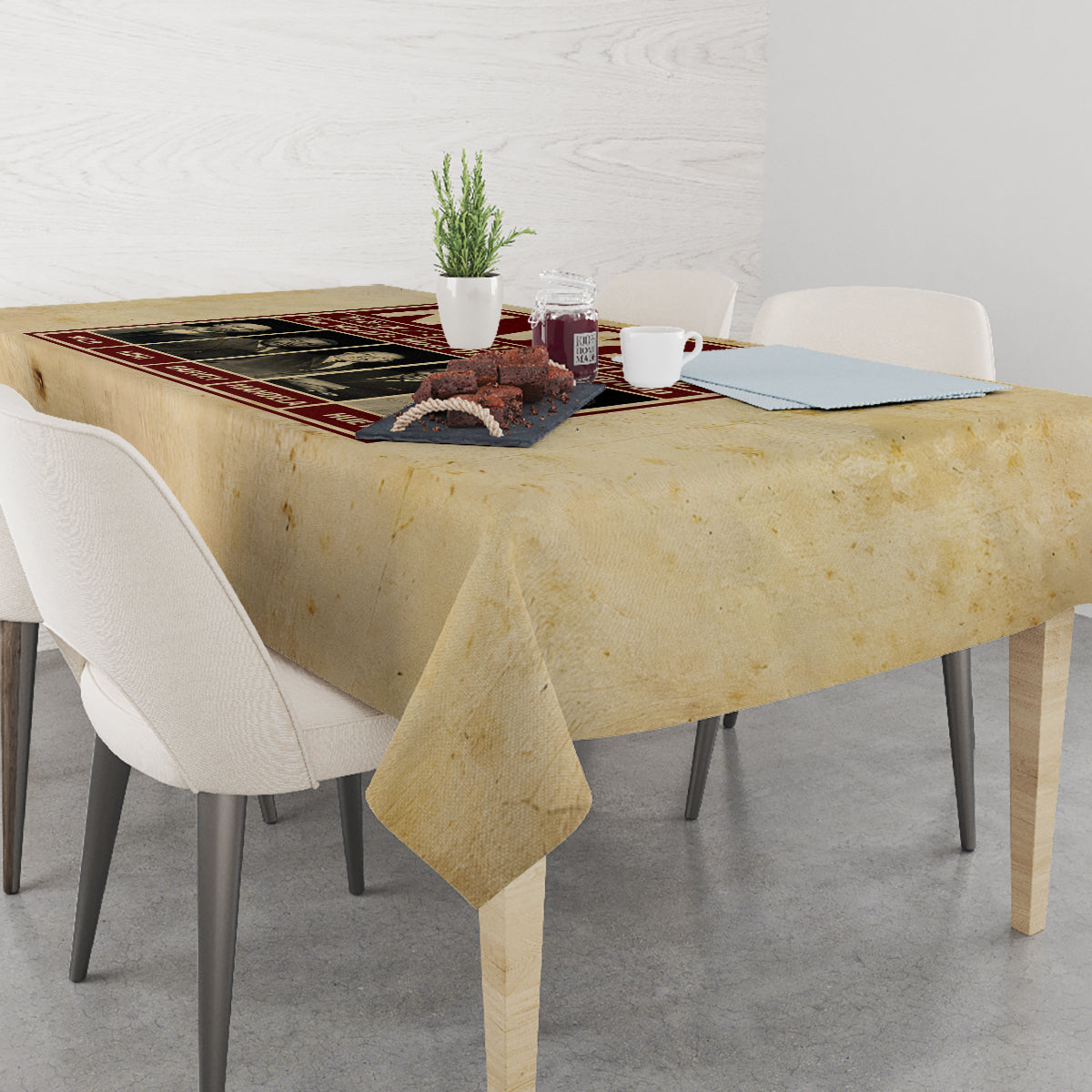 Beige tablecloth with long corner drop on rectangular dining table.