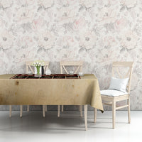 Beige printed tablecloth with burgundy center graphic on sofa table.