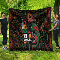 Black quilt with multicolor geometric pattern and face graphic, personalized look