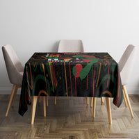 Black tablecloth with colorful abstract print on a square dining table