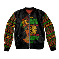 Black satin bomber jacket with colorful patterned sleeves and front graphic text