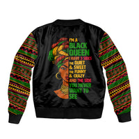 Black bomber jacket back view with colorful patterned sleeves and illustrated queen text