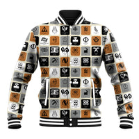White baseball jacket with black ribbed collar, cuffs, and multicolor Adinkra symbol print.
