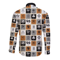 White long-sleeve button shirt with Adinkra symbols in black and orange, back view