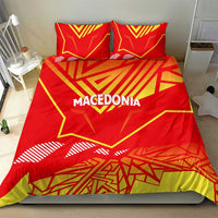 Red duvet cover with yellow geometric Macedonia flag design and two coordinated red pillowcases