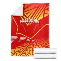 Macedonia flag blanket in red and yellow, folded with 'MACEDONIA' on top