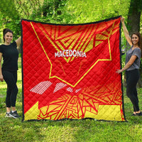 Red and yellow quilt with Macedonian map emblem, "MACEDONIA" lettering, and waving stripe detail