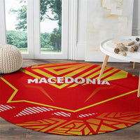 Round red carpet with Macedonia flag pattern, bold yellow lines, and white “MACEDONIA”