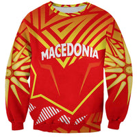 Red crewneck sweatshirt with yellow-and-gold Macedonia graphic on front, long sleeves