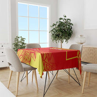Macedonia flag tablecloth draped over dining table; red, yellow, and green design