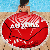 Red round Austria graphic beach blanket with white fringe edge