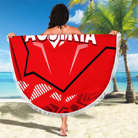 Red round Austria graphic beach blanket with white fringe edge, held up