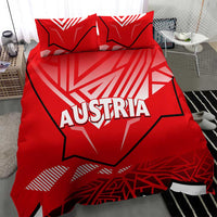 Red duvet cover and pillowcases featuring Austria text and white geometric stripes