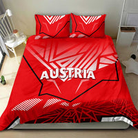 Red duvet cover and two pillowcases with Austria logo and bold abstract shapes