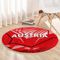 Red round carpet featuring AUSTRIA text and central eagle design