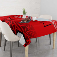 Red tablecloth draped on table with Austria eagle graphic