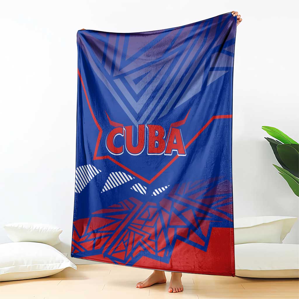 Blue Cuba blanket draped with red and white CUBA logo and geometric pattern