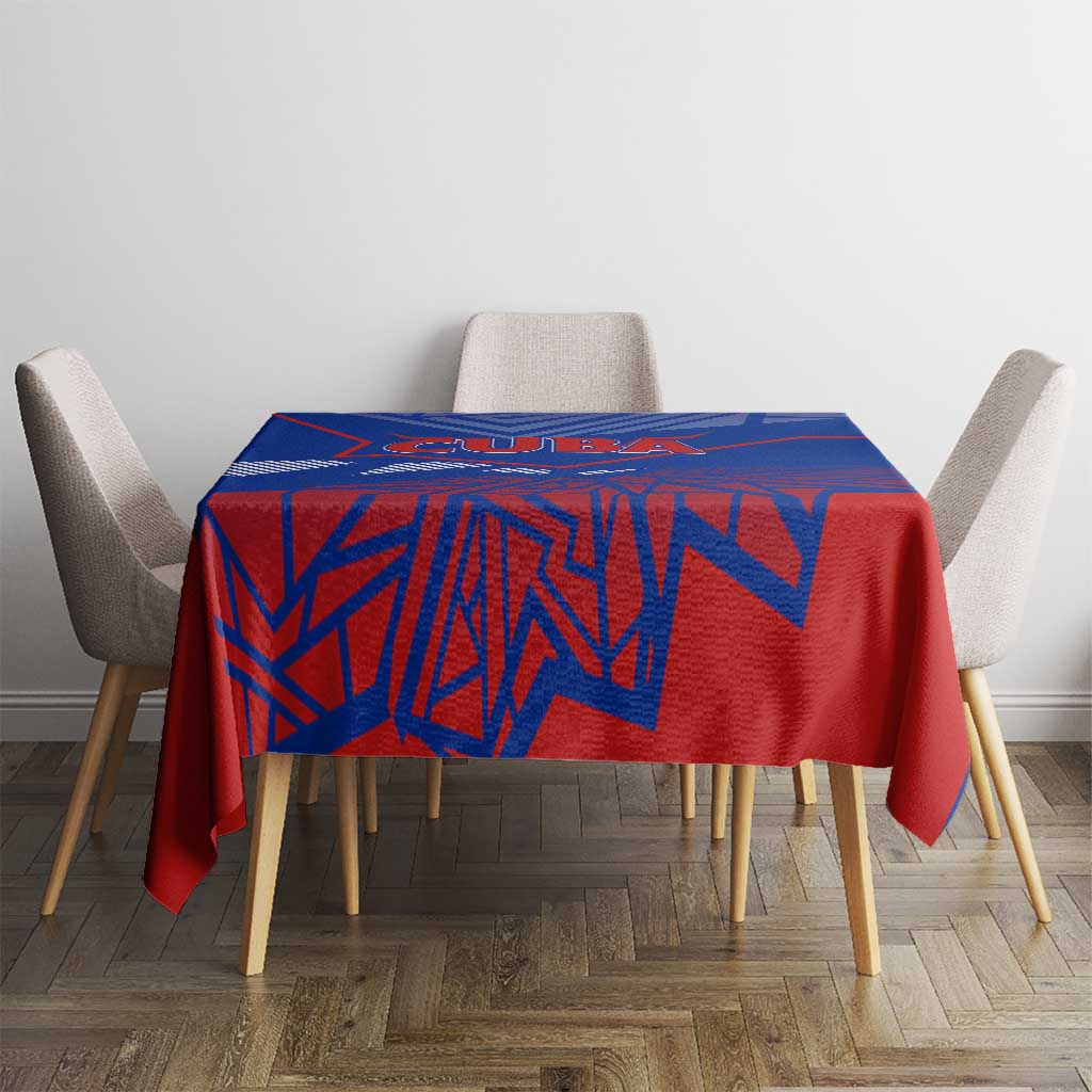 Blue and red patterned tablecloth on dining table with four chairs