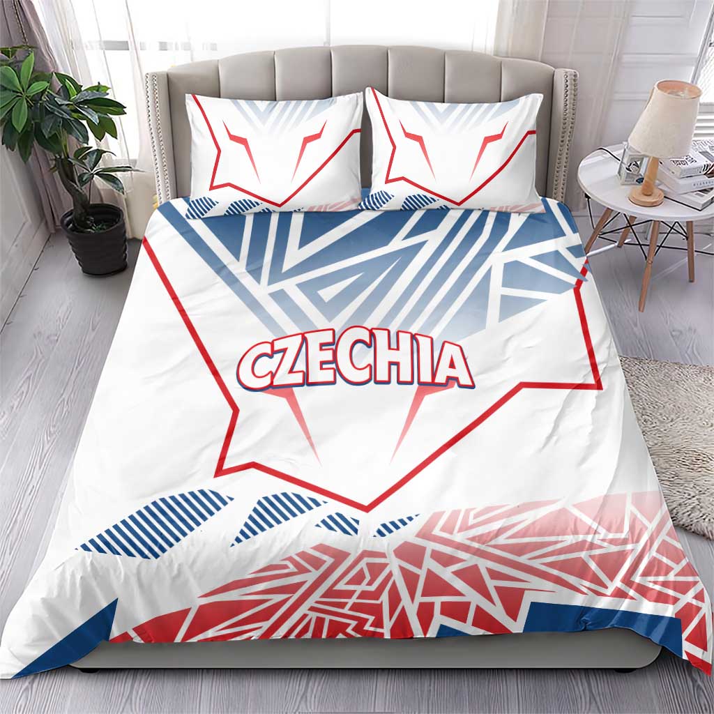 Czechia bedding set on bed: white duvet cover with red and blue graphic, matching pillowcases