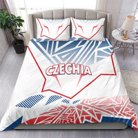 Czechia bedding set on bed: white duvet cover with red and blue graphic, matching pillowcases