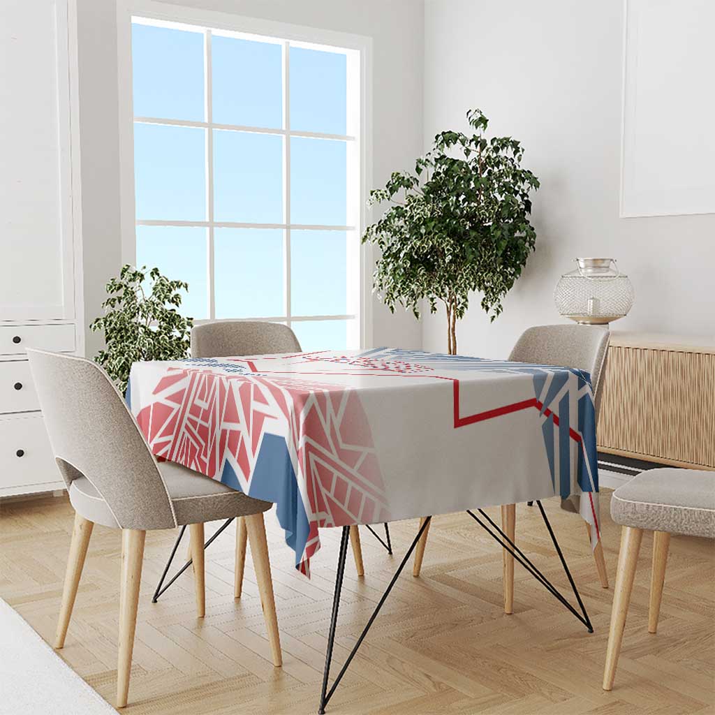 Blue, red and white geometric tablecloth with Czechia-style pattern on a dining table